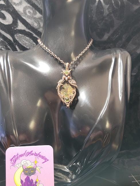 Ammolite w/ Peridot in Antiqued Copper w/ Peekaboo Crescent Moon in the Back Wrapped by Hand