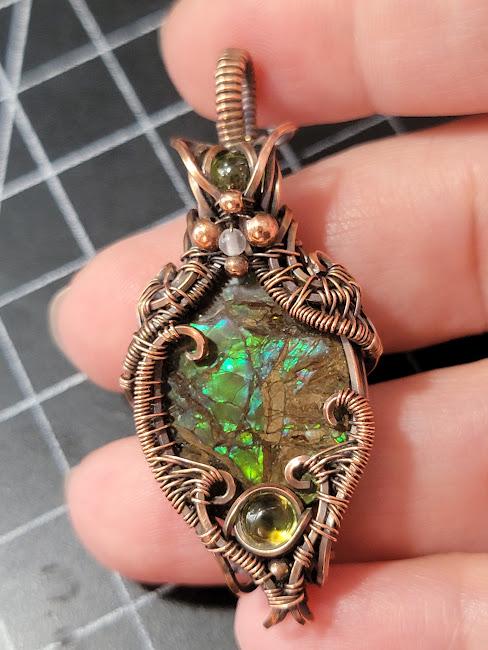 Ammolite w/ Peridot in Antiqued Copper w/ Peekaboo Crescent Moon in the Back Wrapped by Hand