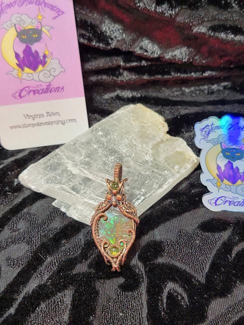 Ammolite w/ Peridot in Antiqued Copper w/ Peekaboo Crescent Moon in the Back Wrapped by Hand